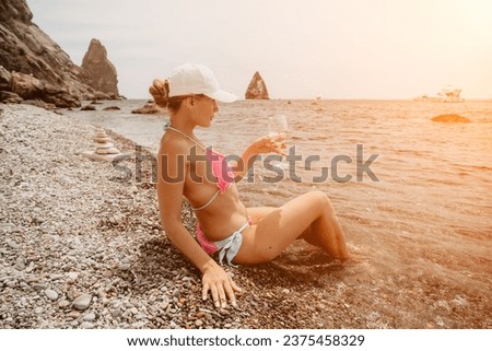 Woman travel sea. Happy tourist in pink bikini enjoy taking picture outdoors for memories. Woman traveler posing on the beach at sea surrounded by volcanic mountains, sharing travel adventure journey