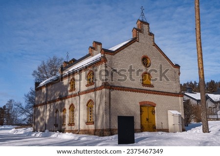 Building with cafe in historical Verla mill museum and village in winter. UNESCO World Heritage Site in Kouvola, Finland. March 6, 2023. Royalty-Free Stock Photo #2375467349