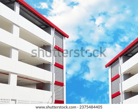 two car park building with blue sky white cloud . square building perspective view on abstract nature bacground
