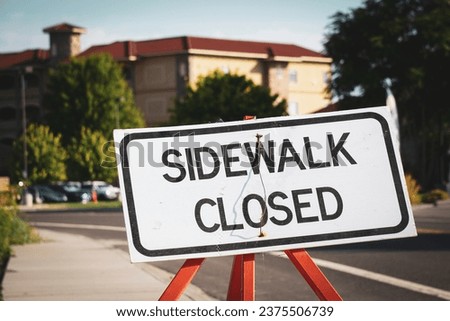 Sidewalk closed sign at construction site