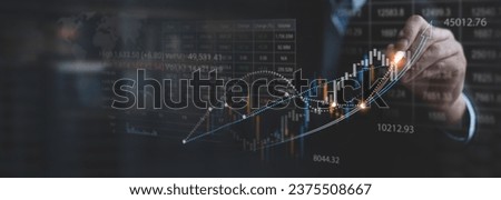 Stock market analysis, business, finance and investment. Finance analyst analyzing stock market trading graph, economic growth chart, planning and strategy, business investment with financial report Royalty-Free Stock Photo #2375508667