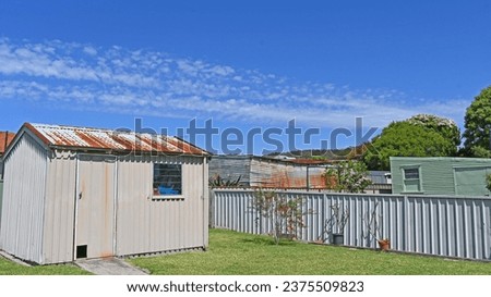Old metal sheds in Australian back yards Royalty-Free Stock Photo #2375509823
