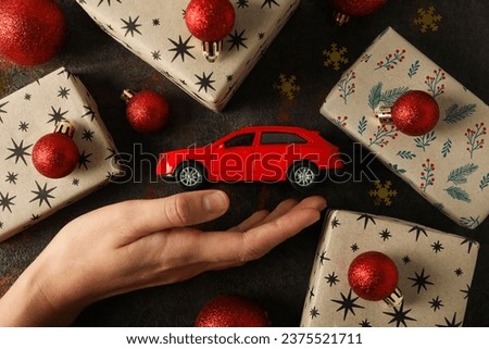 Christmas gifts with a car, top view.
