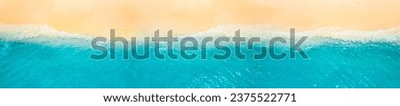 Peaceful aerial wide beach landscape, summer vacation Mediterranean holiday. Waves crash amazing blue ocean bay sea panoramic coastline. Tranquil aerial drone top view. Relaxing sunny beach, seaside