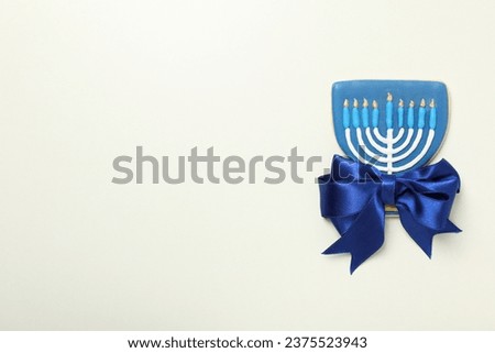 Gingerbread with Hanukkiah on white background, space for text
