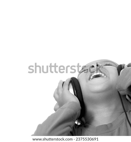 little boy with headphones enjoying music  with white background stock photo