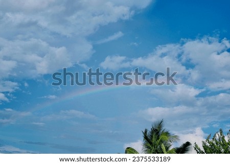 The rainbow in the morning at my house was in the sky with white clouds. It is a very beautiful picture of nature.