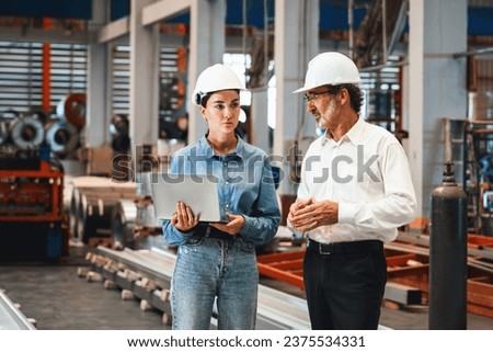 Factory manager or executive make visit metalwork manufacturing factory tour and inspect heavy steel industrial machinery showcase leadership quality as engineering inspection supervisor. Exemplifying Royalty-Free Stock Photo #2375534331