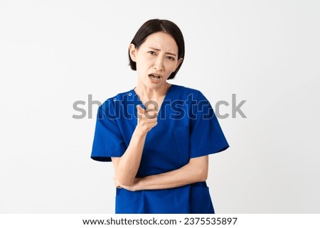 Medical image of a young woman wearing scrubs