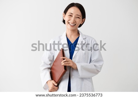 Medical image of a young woman wearing a white coat