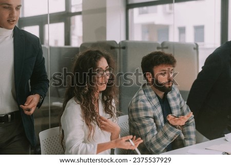 Close up of business woman and man having a shocked reaction while sitting at the business meeting at the conference room Royalty-Free Stock Photo #2375537929