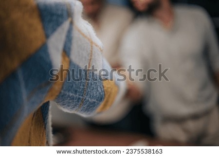 Two colleagues in casual clothing saying goodbye with a handshake. One employee is leaving their job, while the other is ready for their next opportunity. Royalty-Free Stock Photo #2375538163