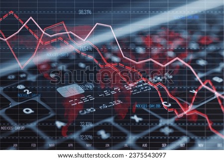 Close up of laptop computer keyboard with bank card and glowing downward red forex chart on blurry background. Crisis, and stock market fall concept. Double exposure
