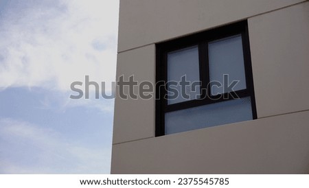 window on a facade against the sky