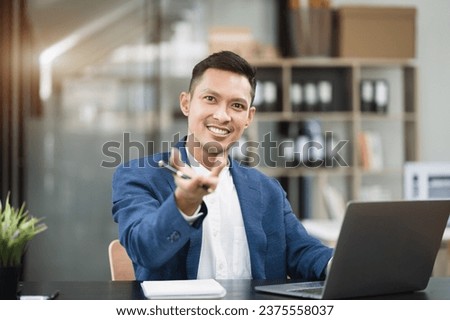 Young man sitting at his desk in the office