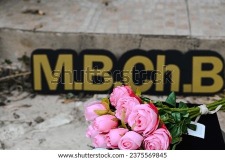 NEW graduation photo  medical field  doctor to be  stethoscope  graduation hat , iam done  graduation flowers pink flower graduation cap  phot session girly photo , M.B.CH.B , medical books , i did it