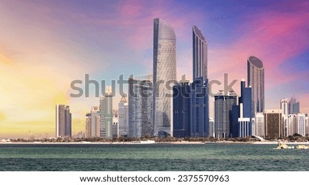 Abu Dhabi skyline with reflection in sea, United Arab Emirates - panorama