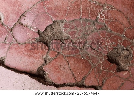 crushed cracked ceramic tile texture. red cracked ceramic background