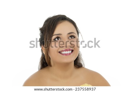 Portrait of a beutiful young lady looking up against a white background