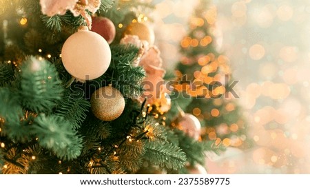 Christmas tree branches with decorations, balls, garlands, bokeh. Postcard with space for text. Merry christmas card. Winter holiday theme. Happy New Year. 