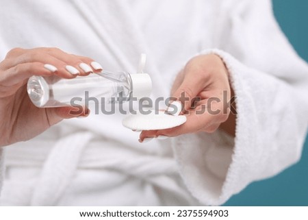 Woman with makeup remover and cotton pad, closeup Royalty-Free Stock Photo #2375594903