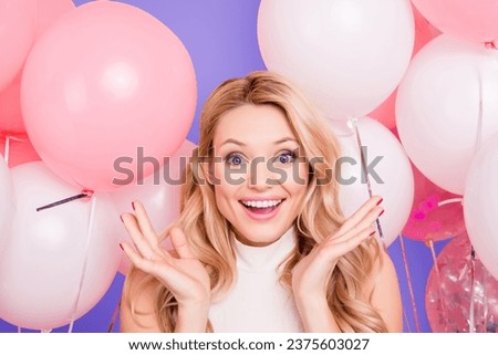 Portrait of impressed astonished girlfriend with unexpected unbelievable emotions gesturing with palms looking at camera isolated on pink background with many white air balloons