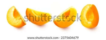 Set of fresh sliced apricots. Apricot slices isolated on white background. Royalty-Free Stock Photo #2375604679