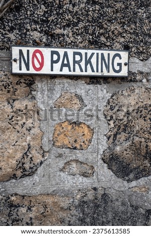 No parking sign in black and red