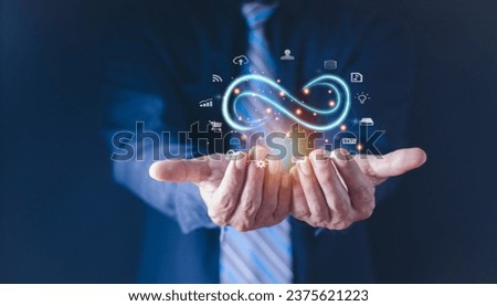 Technology data link concept, Businessman Hands holding virtual infinity with technology marketing online icon for symbol of connection to community metaverse world network system concept.