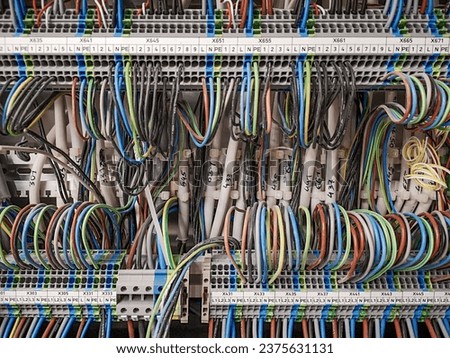 electric wiring cabinet with colorfull stranded cables Royalty-Free Stock Photo #2375631131