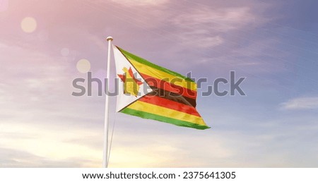 Zimbabwe national flag waving in beautiful sky. The flag waving with dynamic angle.