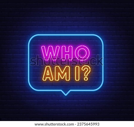 Who Am I neon sign in the speech bubble on brick wall background. Royalty-Free Stock Photo #2375645993