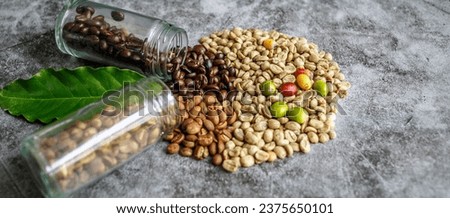 many varieties of coffee beans available, including both fresh roasted and unroasted options in coffee cups, green coffee beans, and medium and dark roasted. Royalty-Free Stock Photo #2375650101