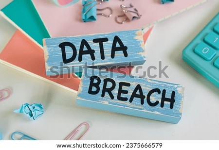 Wooden blocks with words Data Breach. Business concept