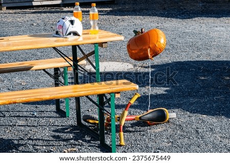 orange pumpkin balloon near the children bicycle. halloween celebration. no people.