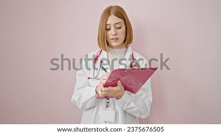 Young blonde woman doctor writing on clipboard speaking over isolated pink background