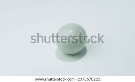 Bluish colored raw duck egg isolated on white background