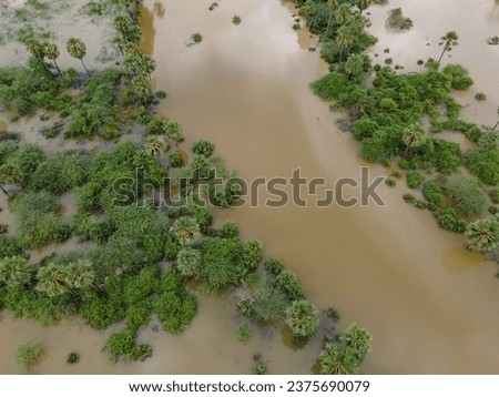 drone shot aerial view top angle panoramic photograph of dam reservoir river flooding overflowing erosion alluvial soil agricultural fields fertile cultivation india tamilnadu swamp cloudy wallpaper 