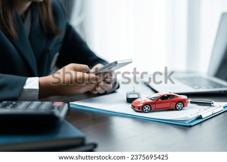 Business concept, car insurance, sell and buy car, car financing, car key for vehicle sales agreement.  dealer is explaining to customers about loans with rental  insurance. Buying a 