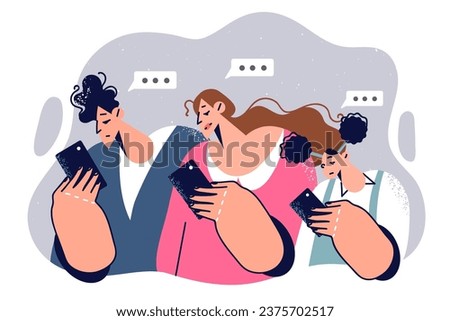 Family looks at smartphones and experiences digital addiction, waving at communication. Man with wife and daughter chatting on smartphones and exchanging news through sms messenger applications Royalty-Free Stock Photo #2375702517