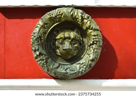 Decorative vintage old fashioned metal lion door knocker, antique red door handles