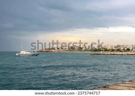 View of Rafina city under a autumnal dramatic sky