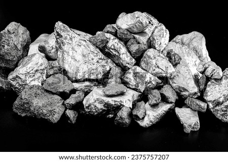 several rough stones, silver, manganese, tin, chrome and platinum. Mining concept, industrial material. Royalty-Free Stock Photo #2375757207