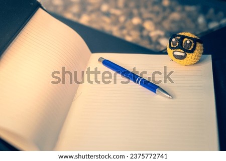 notebook, pen and nerdy emoji amigurumi