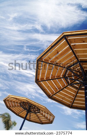 parasols on a cloudy sky. Ordinary picture of the rest.
