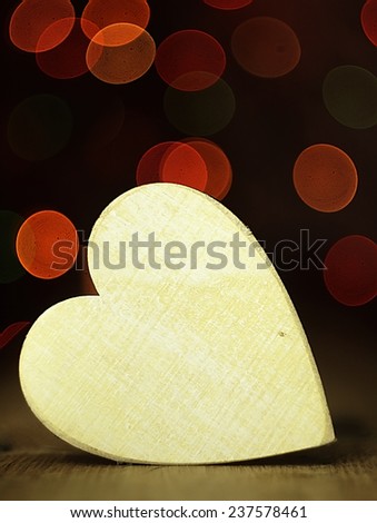 Heart on a wooden boards background.