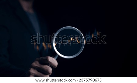 Stock investment concept. Businessman hand holding magnifying glass with virtual stock market chart, Currency exchange trade, Graph analysis technical, Business growth, Economic report, Money wealth, Royalty-Free Stock Photo #2375790675