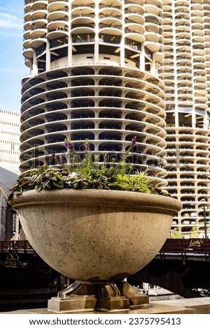 a picture of marina bay condos in chicago illinois framed as though the building is growing out of a flower pot