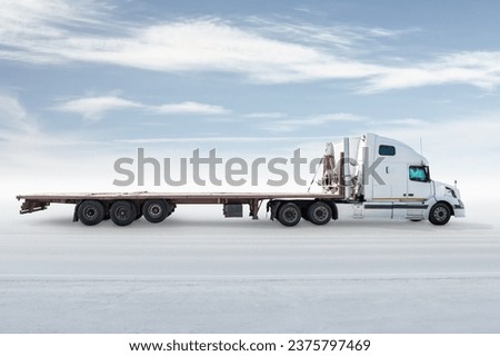 White long distance bonnet truck with a semitrailer isolated on bright background with sky Royalty-Free Stock Photo #2375797469