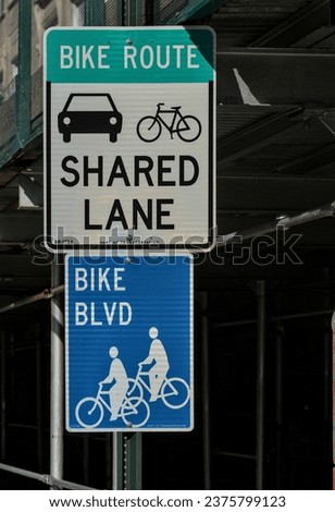 bike route street sign (shared lane, bicycle, car) with blue bike blvd sign (boulevard) cycling infrastructure, biking lanes in brooklyn (nyc)